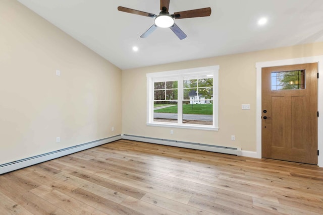 26 June St, Sanford, ME 04073 - entryway featuring a baseboard heating unit, healthy amount of natural light, light wood-type flooring, lofted ceiling, and recessed lighting