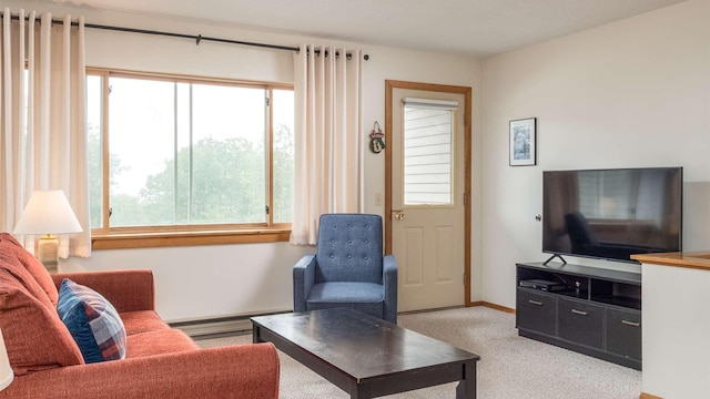 8 Sunrise Dr Unit A115, Newry, ME 04261 - carpeted living area with a baseboard radiator and a healthy amount of sunlight