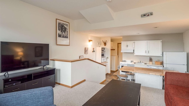 8 Sunrise Dr Unit A115, Newry, ME 04261 - carpeted living area with baseboards and a sink