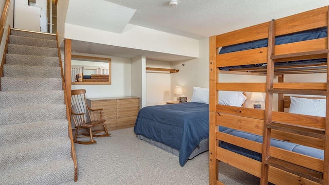 8 Sunrise Dr Unit A115, Newry, ME 04261 - carpeted bedroom with a textured ceiling