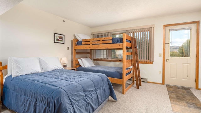 8 Sunrise Dr Unit A115, Newry, ME 04261 - carpeted bedroom featuring baseboards, multiple windows, and a textured ceiling