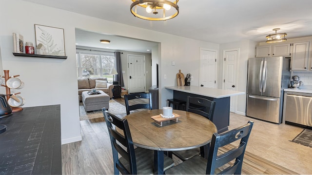 8 Orchard Hills Pkwy Unit 8, Bangor, ME 04401 - dining area with light wood-style flooring and baseboards