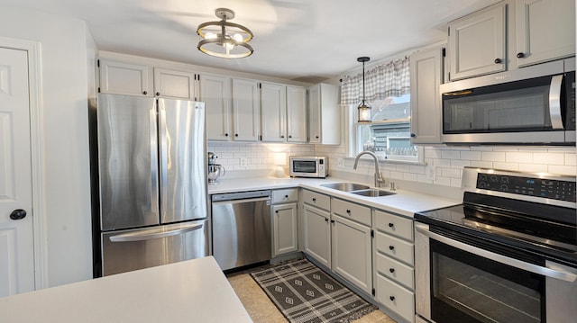 8 Orchard Hills Pkwy Unit 8, Bangor, ME 04401 - kitchen featuring appliances with stainless steel finishes, a sink, backsplash, and light countertops