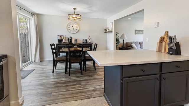 8 Orchard Hills Pkwy Unit 8, Bangor, ME 04401 - kitchen with light countertops, a chandelier, dark wood-type flooring, decorative light fixtures, and gray cabinetry
