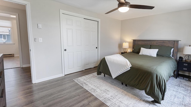 8 Orchard Hills Pkwy Unit 8, Bangor, ME 04401 - bedroom with wood finished floors, a baseboard radiator, baseboards, a closet, and ceiling fan