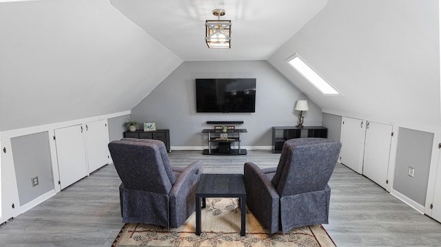 8 Orchard Hills Pkwy Unit 8, Bangor, ME 04401 - living room featuring a skylight, light wood-type flooring, lofted ceiling, and baseboards