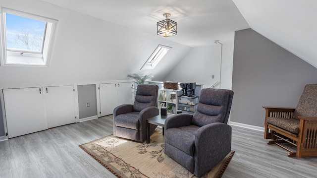 8 Orchard Hills Pkwy Unit 8, Bangor, ME 04401 - living area with a skylight, vaulted ceiling, and light wood-type flooring