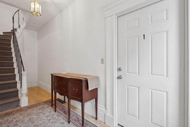 17 Pine St Unit 1, Portland, ME 04102 - foyer entrance featuring wood finished floors, stairs, and baseboards