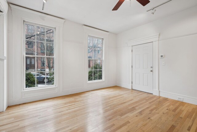 17 Pine St Unit 1, Portland, ME 04102 - spare room featuring hardwood / wood-style floors, ceiling fan, rail lighting, and baseboards