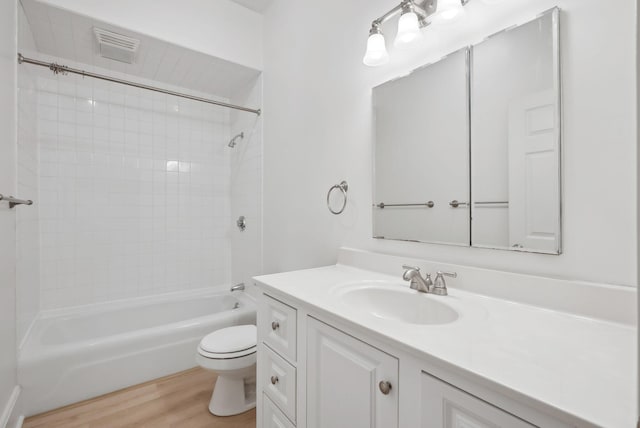 17 Pine St Unit 1, Portland, ME 04102 - full bath featuring toilet, wood finished floors,  shower combination, and vanity