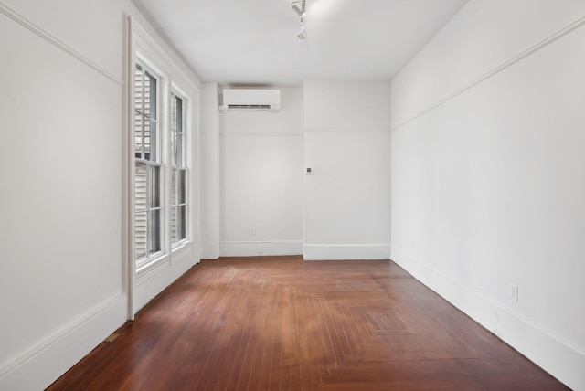 17 Pine St Unit 1, Portland, ME 04102 - empty room featuring an AC wall unit, baseboards, healthy amount of natural light, and wood finished floors