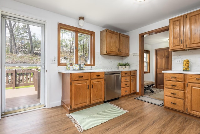 784 Ocean Ave, Portland, ME 04103 - kitchen featuring stainless steel dishwasher, light countertops, and light wood finished floors