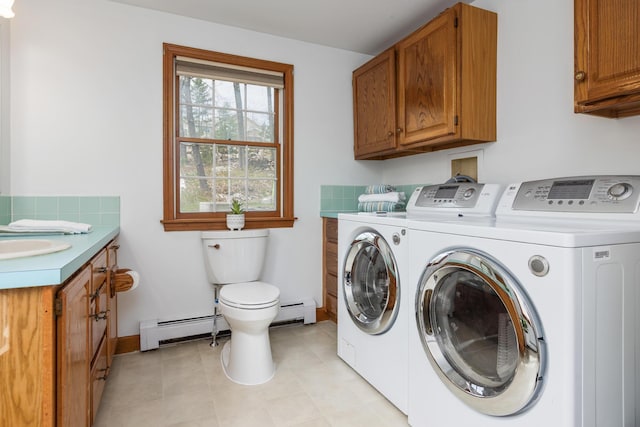 784 Ocean Ave, Portland, ME 04103 - laundry room with a baseboard radiator, independent washer and dryer, and baseboards