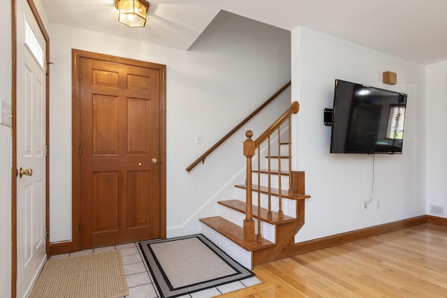 784 Ocean Ave, Portland, ME 04103 - entryway with stairs, baseboards, and light wood-style flooring