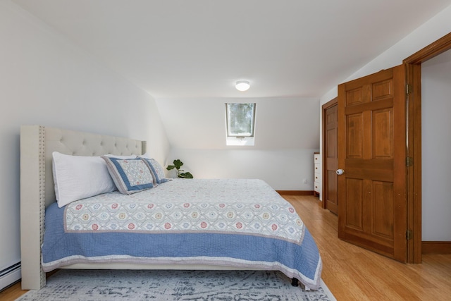 784 Ocean Ave, Portland, ME 04103 - bedroom featuring light wood-style flooring, a baseboard heating unit, and baseboards