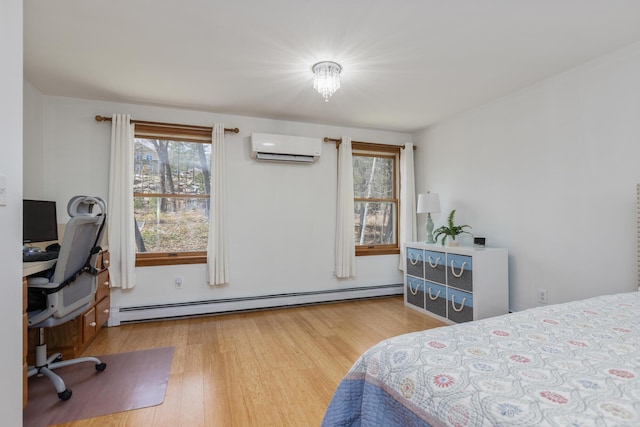 784 Ocean Ave, Portland, ME 04103 - bedroom with a baseboard heating unit, a wall mounted air conditioner, an office area, and multiple windows