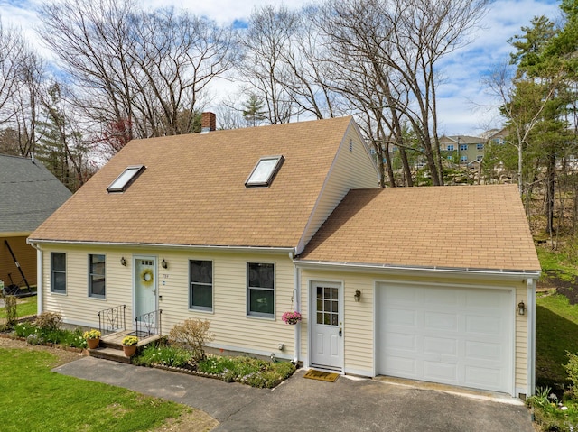 784 Ocean Ave, Portland, ME 04103 - cape cod house featuring a garage, a chimney, a shingled roof, and asphalt driveway