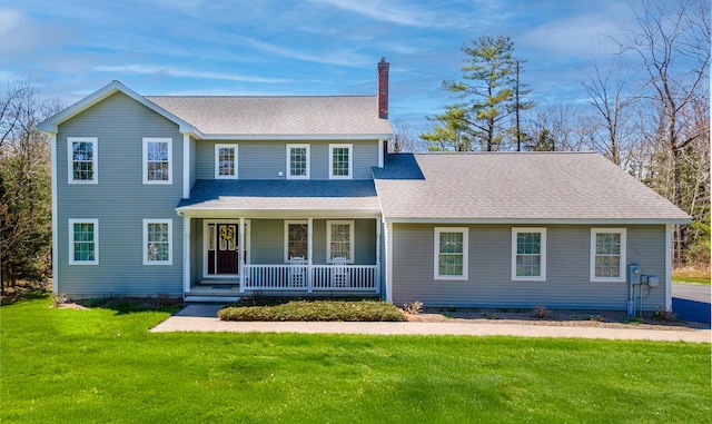 74 Town Farm Rd, Hampden, ME 04444 - traditional-style house with a porch, a chimney, a front lawn, and roof with shingles