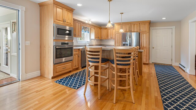 74 Town Farm Rd, Hampden, ME 04444 - kitchen featuring appliances with stainless steel finishes, light wood-type flooring, baseboards, hanging light fixtures, and recessed lighting