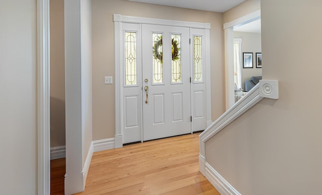 74 Town Farm Rd, Hampden, ME 04444 - foyer entrance with light wood finished floors and baseboards
