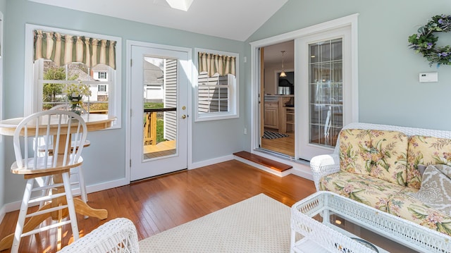 74 Town Farm Rd, Hampden, ME 04444 - doorway with vaulted ceiling, hardwood / wood-style flooring, and baseboards