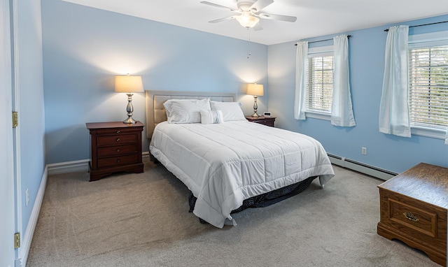 74 Town Farm Rd, Hampden, ME 04444 - carpeted bedroom with a baseboard radiator, ceiling fan, and baseboards