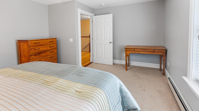 74 Town Farm Rd, Hampden, ME 04444 - bedroom featuring a baseboard heating unit, light colored carpet, and baseboards