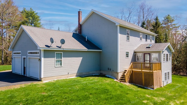 74 Town Farm Rd, Hampden, ME 04444 - rear view of property with stairway, a wooden deck, a chimney, a garage, and a lawn