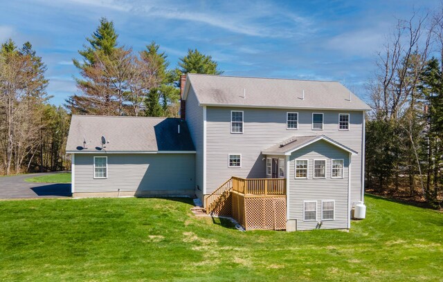 74 Town Farm Rd, Hampden, ME 04444 - back of property with a yard, a deck, and a chimney