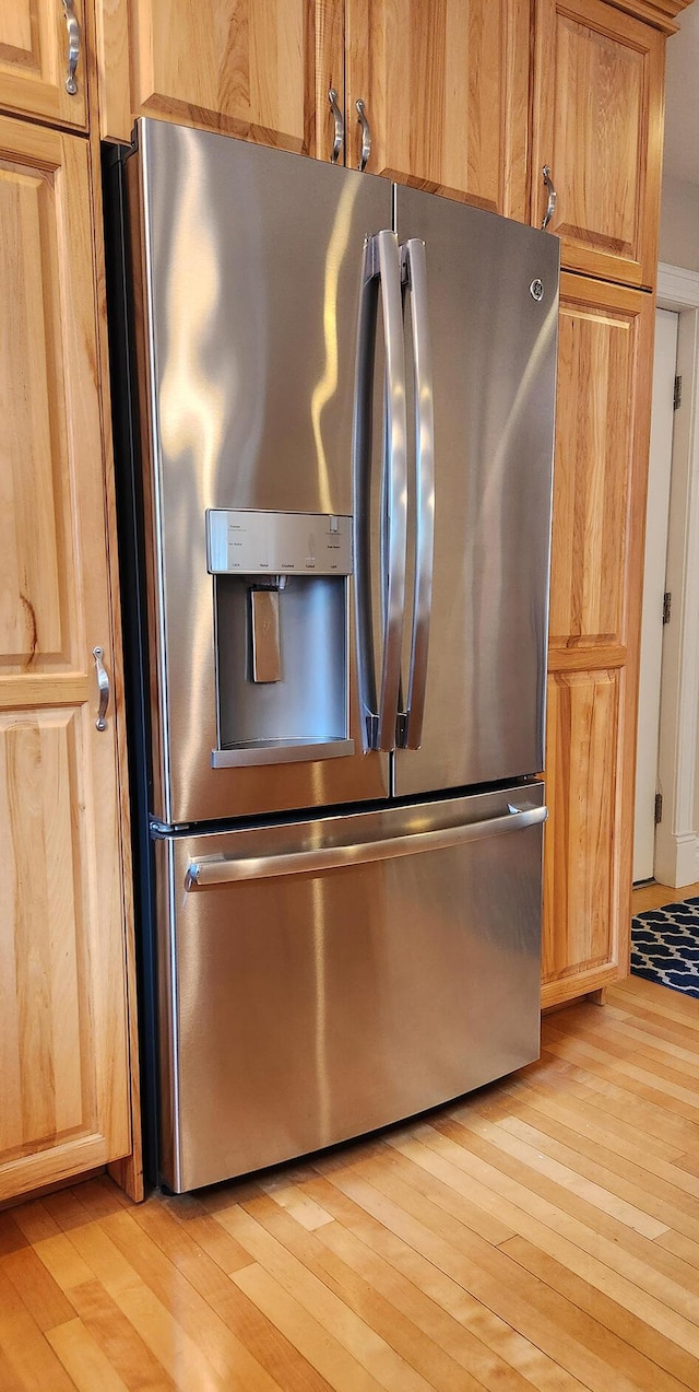 74 Town Farm Rd, Hampden, ME 04444 - kitchen view of stainless steel fridge and light wood-style floors
