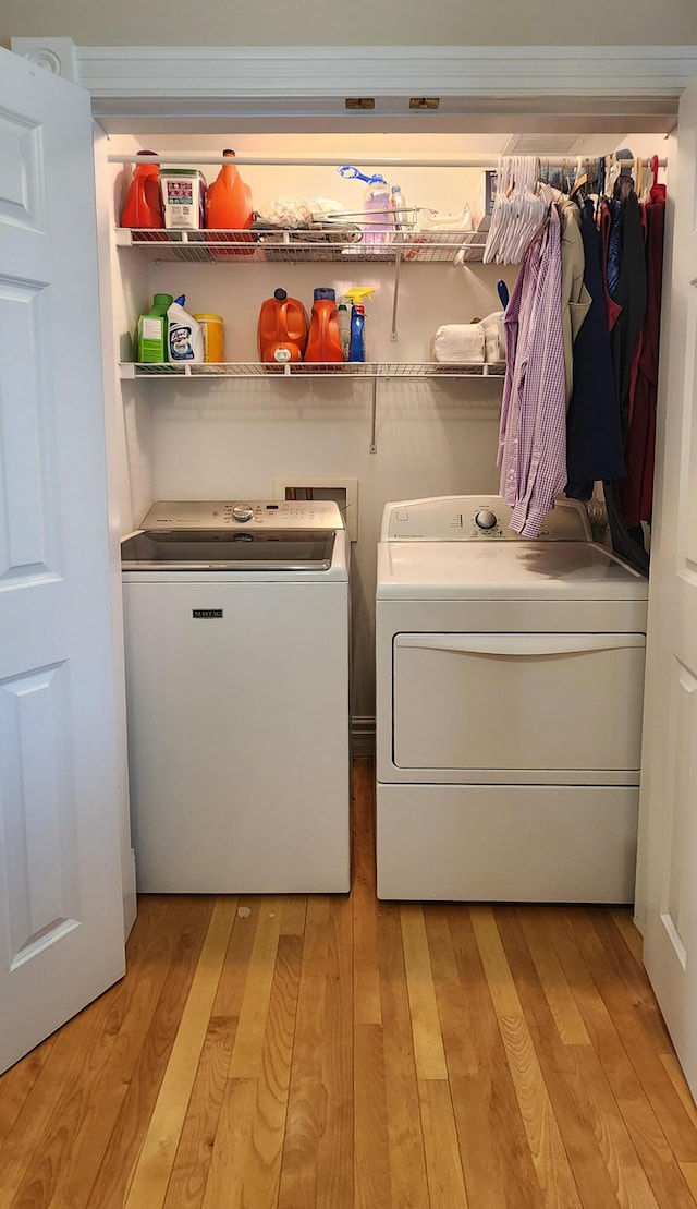 74 Town Farm Rd, Hampden, ME 04444 - laundry area with washer and dryer and light wood-type flooring