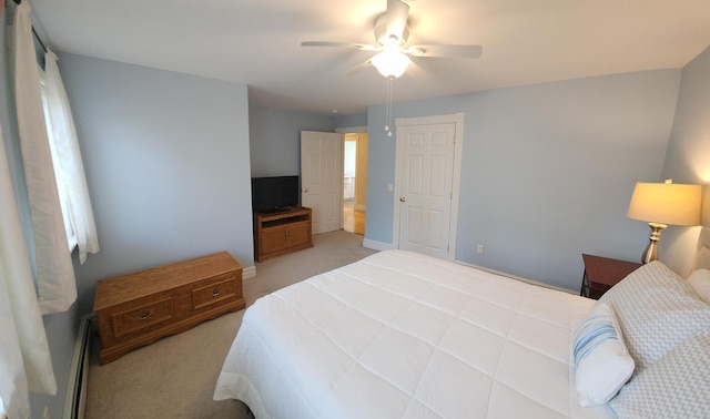 74 Town Farm Rd, Hampden, ME 04444 - bedroom featuring light carpet, ceiling fan, baseboards, and a baseboard heating unit