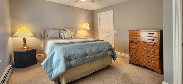 74 Town Farm Rd, Hampden, ME 04444 - bedroom featuring baseboard heating, light carpet, baseboards, and a ceiling fan