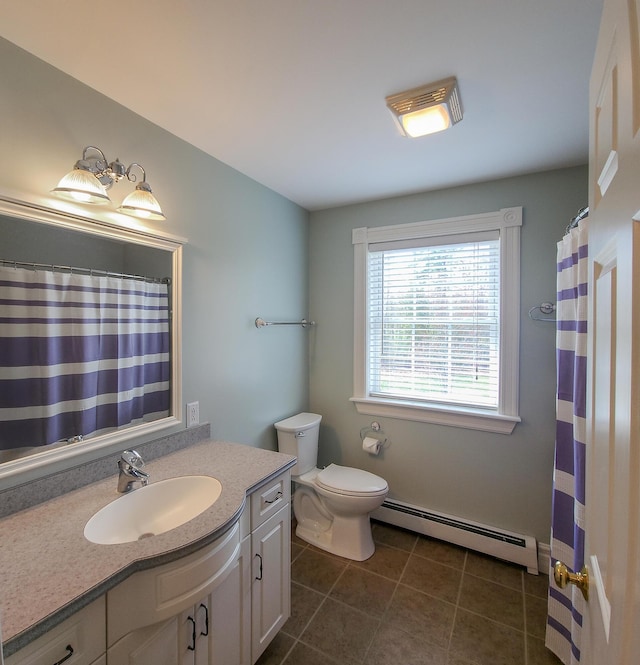 74 Town Farm Rd, Hampden, ME 04444 - full bath featuring a baseboard radiator, vanity, tile patterned flooring, and toilet