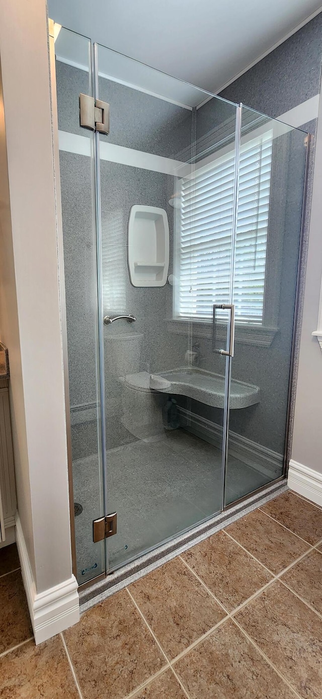 74 Town Farm Rd, Hampden, ME 04444 - bathroom with a stall shower, tile patterned flooring, and baseboards