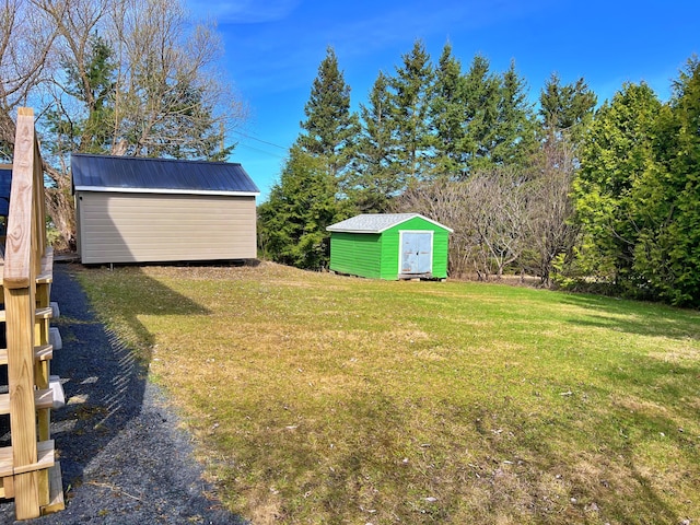 99 St John Rd, Fort Kent, ME 04743 - view of yard featuring an outdoor structure and a storage unit