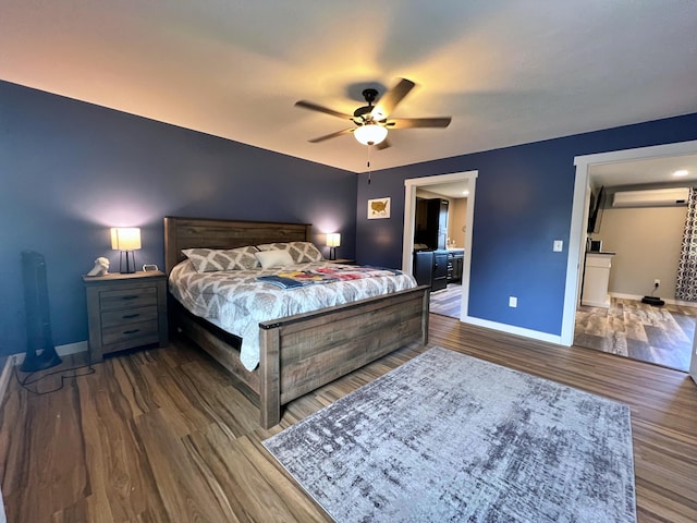 99 St John Rd, Fort Kent, ME 04743 - bedroom featuring baseboards, an AC wall unit, ceiling fan, and wood finished floors