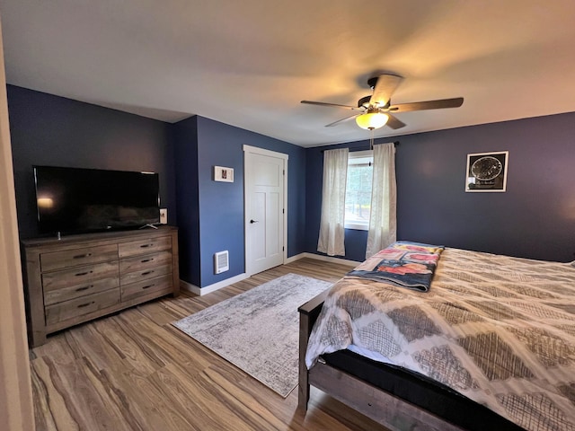 99 St John Rd, Fort Kent, ME 04743 - bedroom with visible vents, wood finished floors, baseboards, and ceiling fan