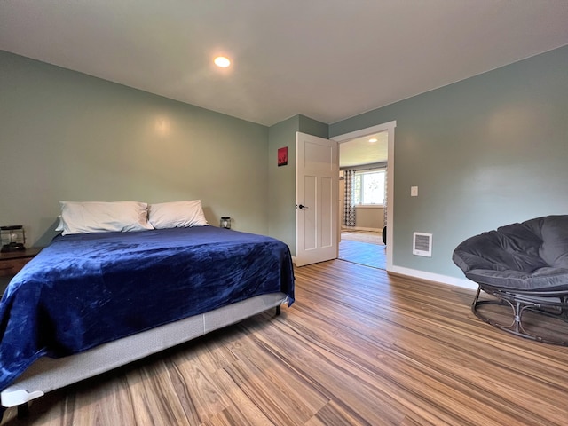 99 St John Rd, Fort Kent, ME 04743 - bedroom with recessed lighting, baseboards, visible vents, and wood finished floors