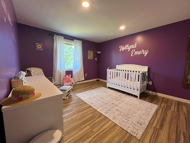 99 St John Rd, Fort Kent, ME 04743 - bedroom featuring recessed lighting, baseboards, a crib, and wood finished floors