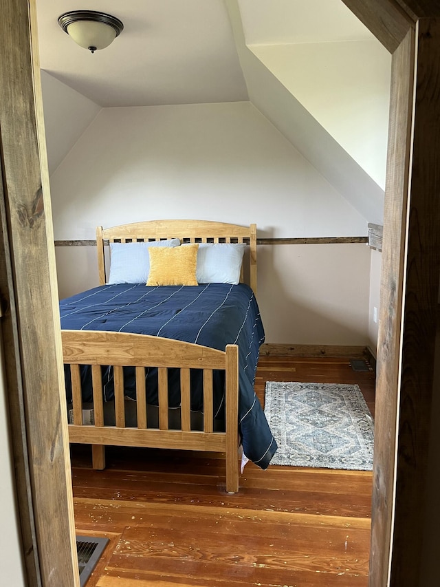 168 Guzzle Rd, Gouldsboro, ME 04607 - bedroom with lofted ceiling and wood-type flooring