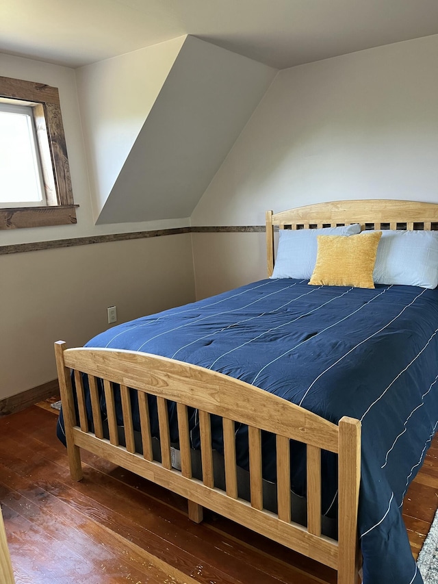 168 Guzzle Rd, Gouldsboro, ME 04607 - bedroom featuring baseboards, lofted ceiling, and wood-type flooring