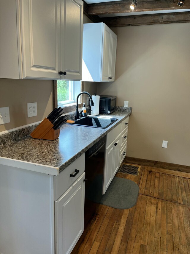 168 Guzzle Rd, Gouldsboro, ME 04607 - kitchen featuring a sink, white cabinetry, dark wood-style flooring, baseboards, and black appliances