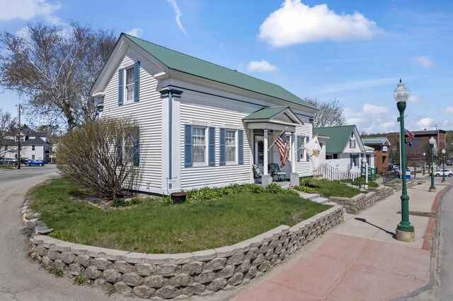 98 Main St, Winthrop, ME 04364 - view of front of property with a front lawn and a residential view