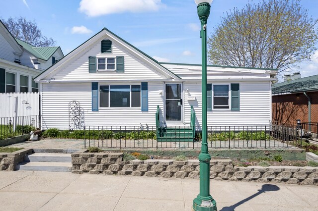 98 Main St, Winthrop, ME 04364 - view of front of house featuring a fenced front yard and entry steps
