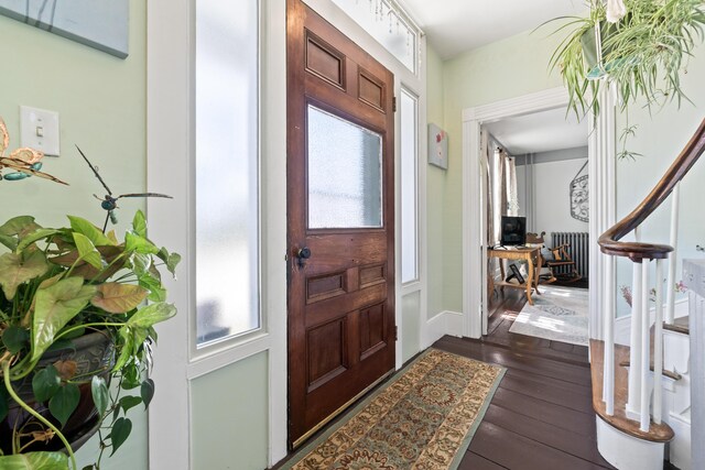 98 Main St, Winthrop, ME 04364 - entrance foyer with dark wood-type flooring and radiator