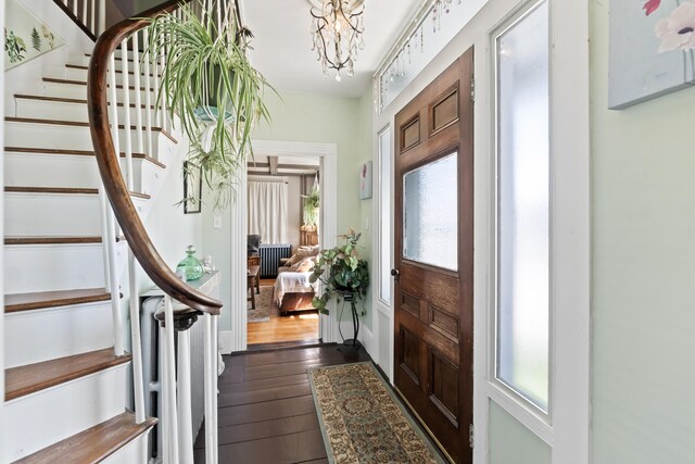 98 Main St, Winthrop, ME 04364 - foyer with stairway, dark wood-style floors, and a chandelier