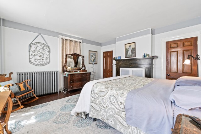 98 Main St, Winthrop, ME 04364 - bedroom with radiator heating unit and wood finished floors