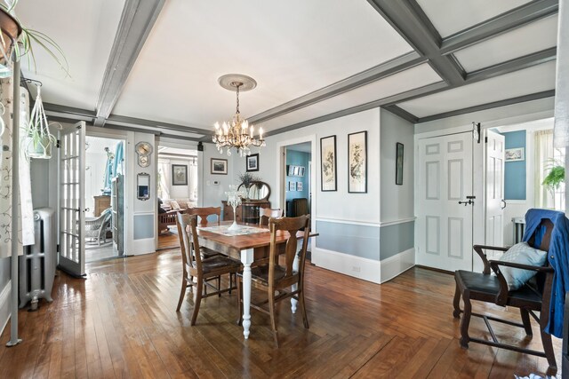 98 Main St, Winthrop, ME 04364 - dining room featuring baseboards, a chandelier, radiator, beamed ceiling, and coffered ceiling