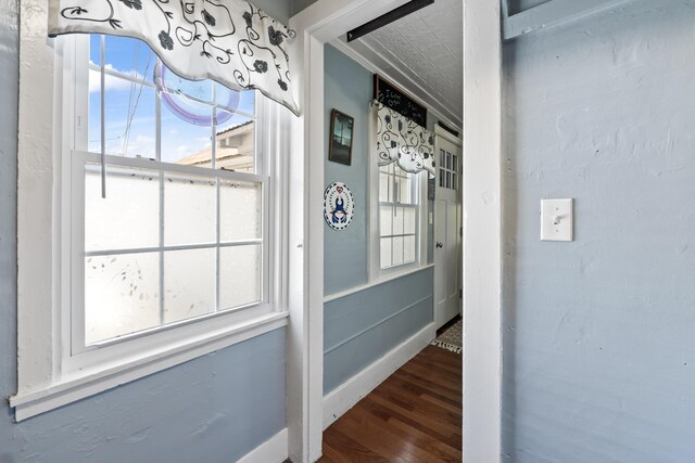 98 Main St, Winthrop, ME 04364 - hall featuring wood finished floors, baseboards, and crown molding